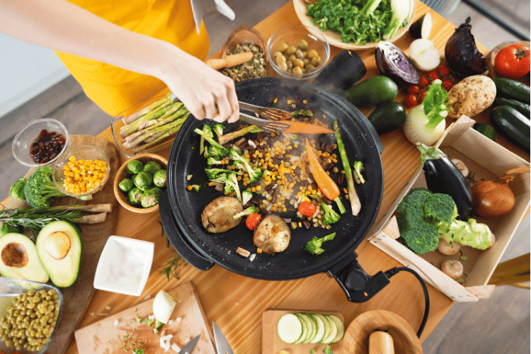 A woman preparing a vegan stir fry